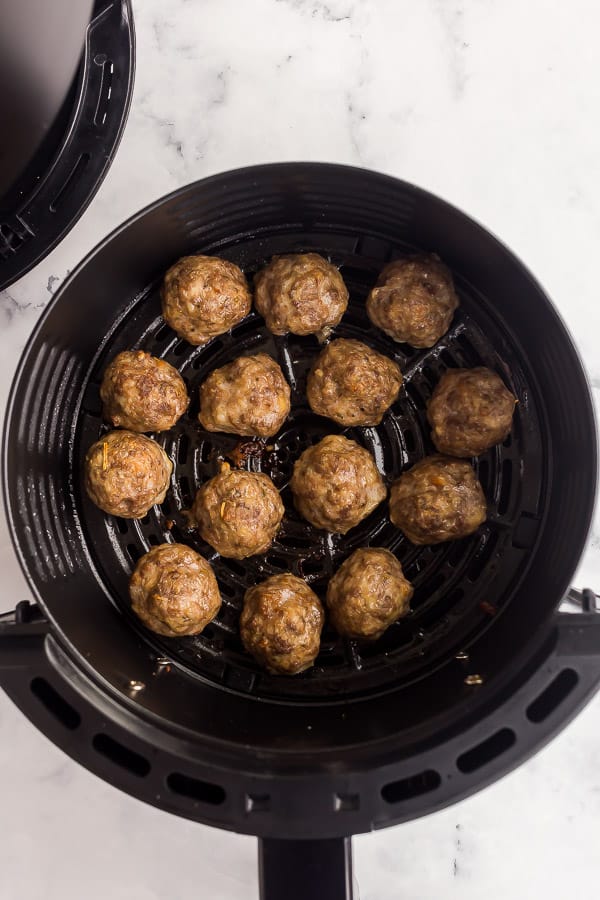 overhead image of air fryer meatballs in air fryer basket