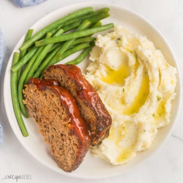 square image of air fryer meatloaf with mashed potatoes and green beans