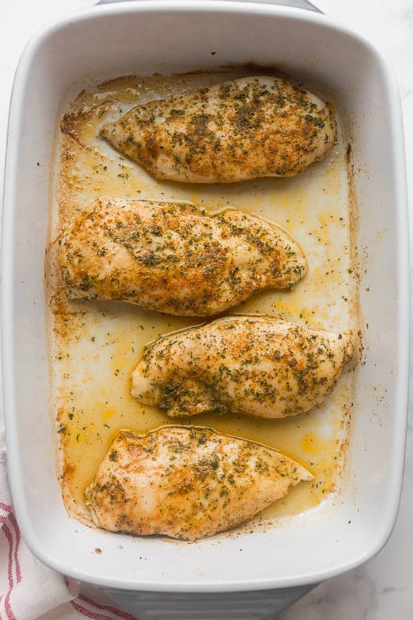 baked chicken breasts in white baking dish