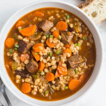 beef and barley soup in a bowl overhead