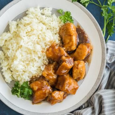 crockpot orange chicken on grey plate overhead