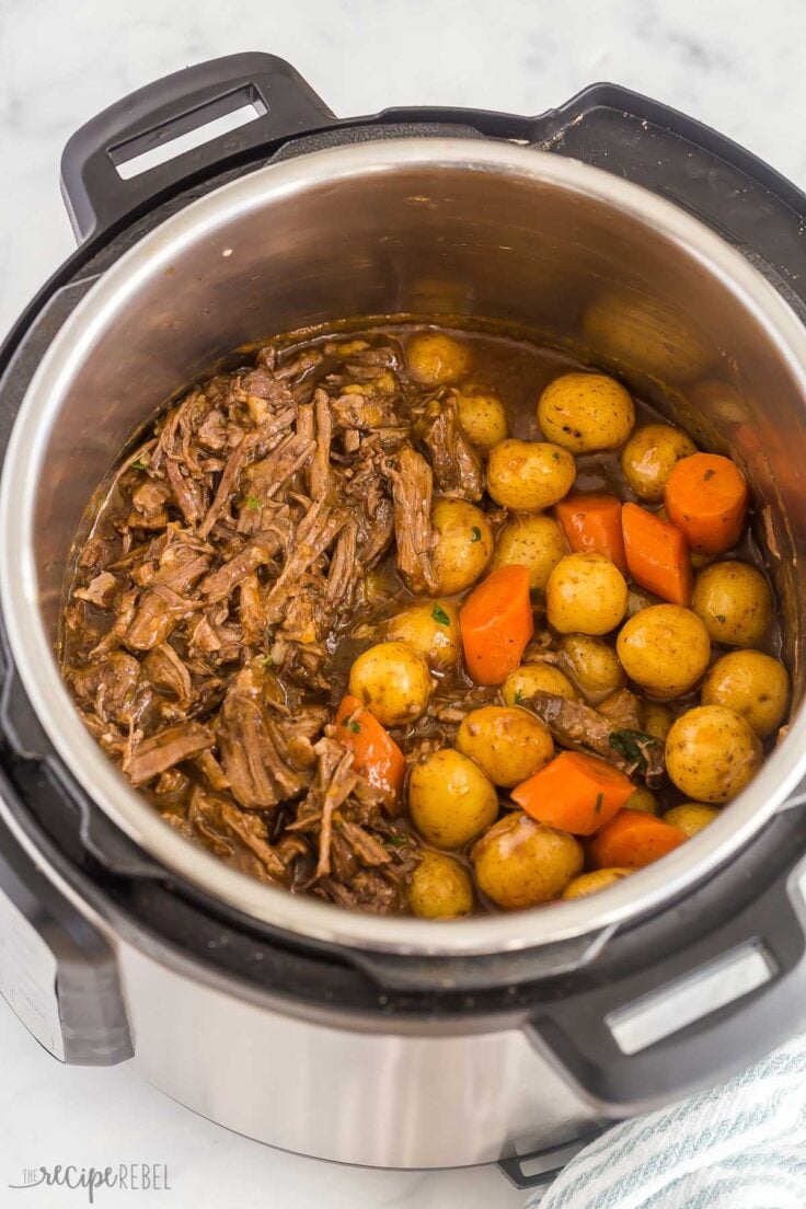 instant pot pot roast with potatoes and carrots in pressure cooker