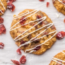Top view of Oatmeal Cranberry Cookies on a white surface.