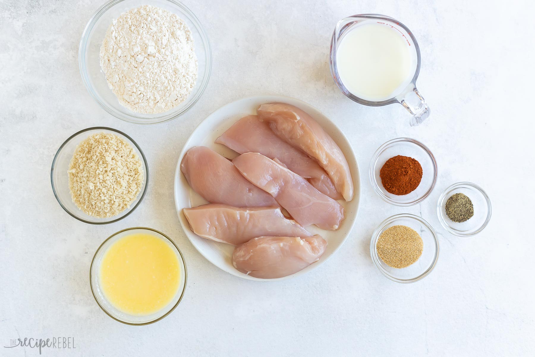 ingredients needed for baked fried chicken on white background.