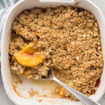 peach crisp in white baking dish overhead