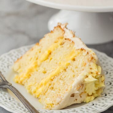 slice of pineapple coconut cake on white plate