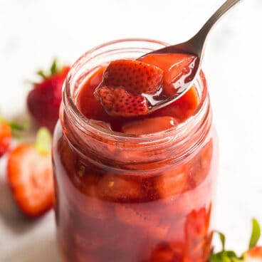 strawberry sauce in jar with spoon