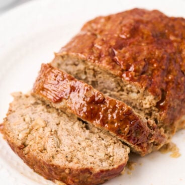 close up image of turkey meatloaf on white platter